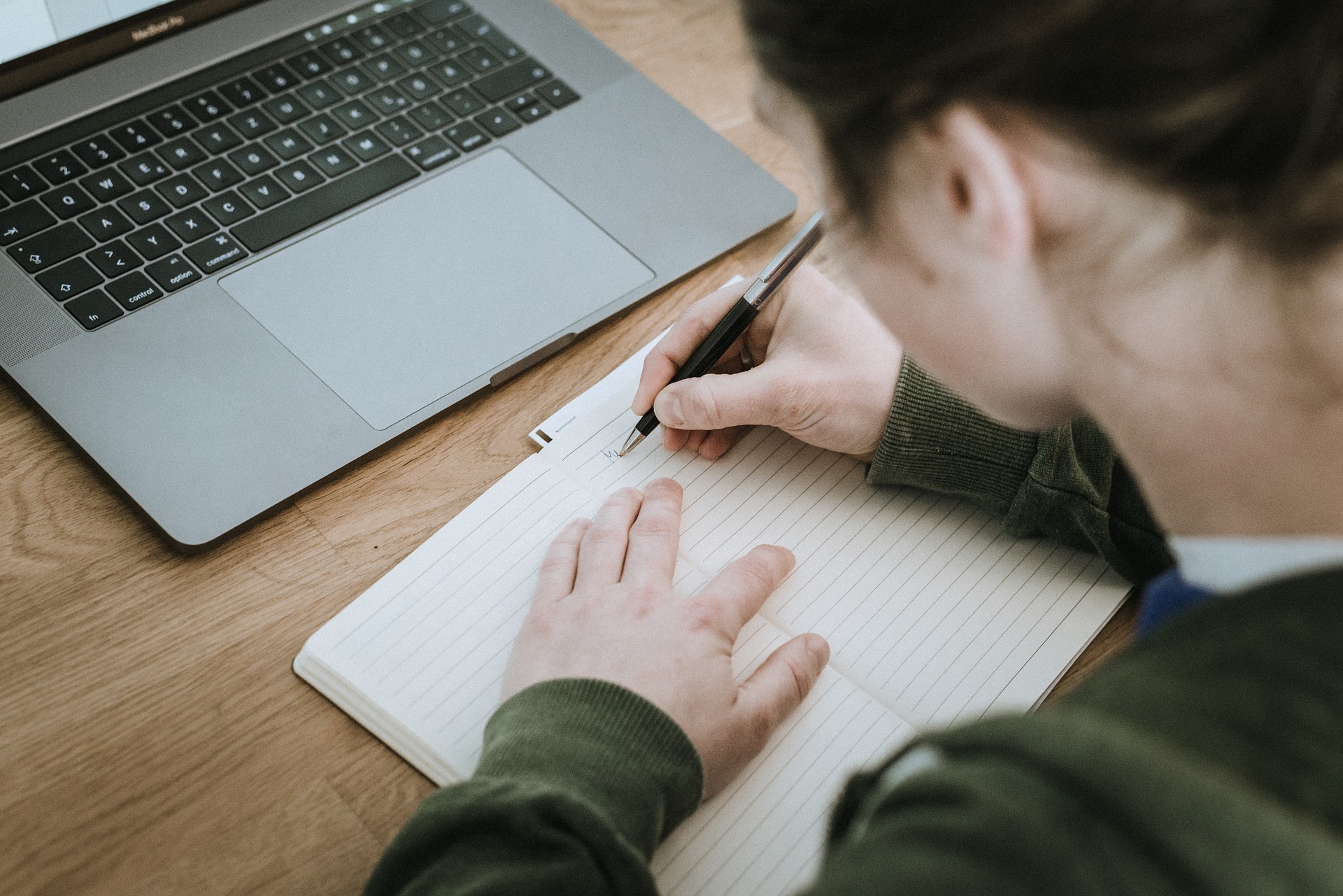 Woman writing in a notebook