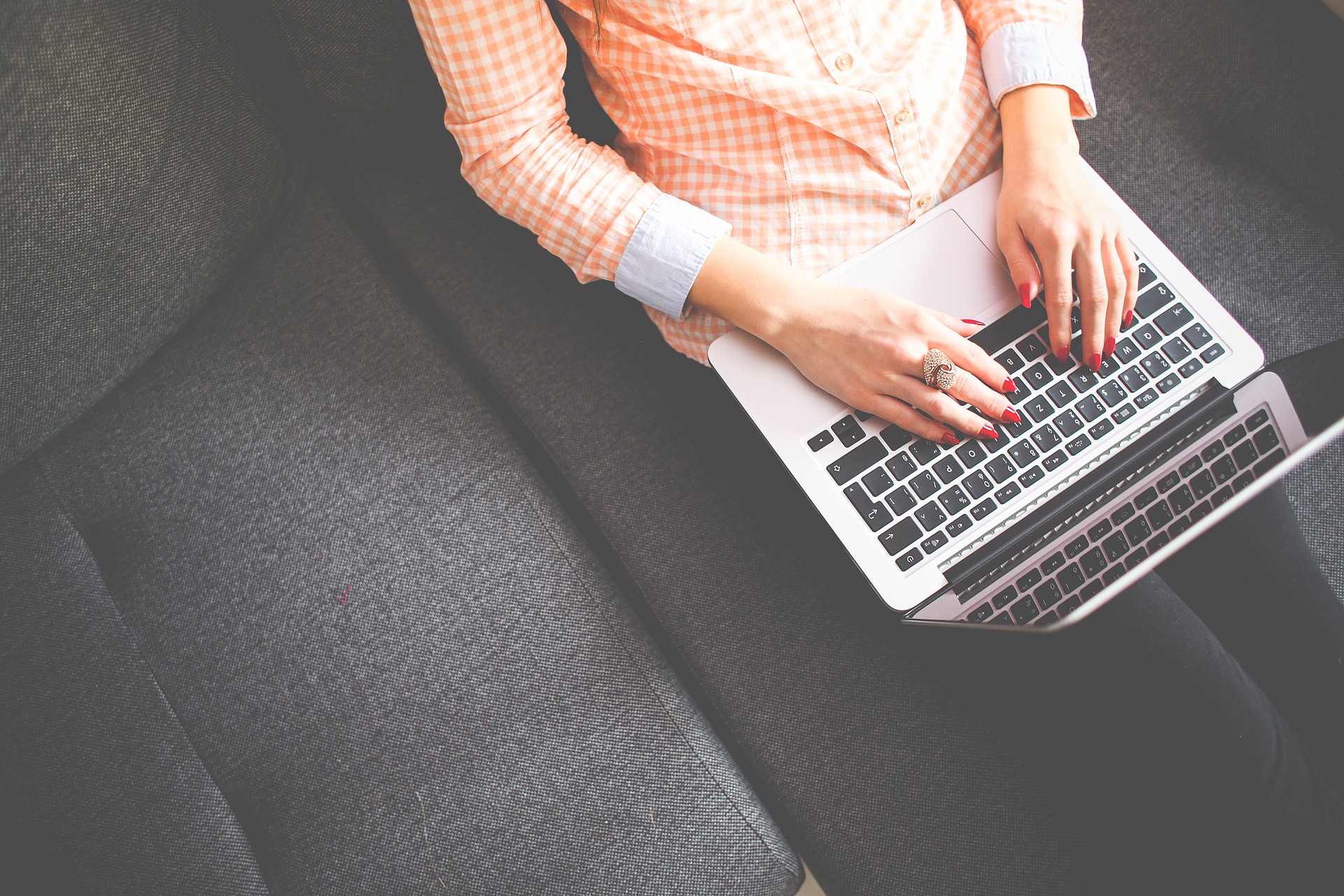 Woman typing on a laptop