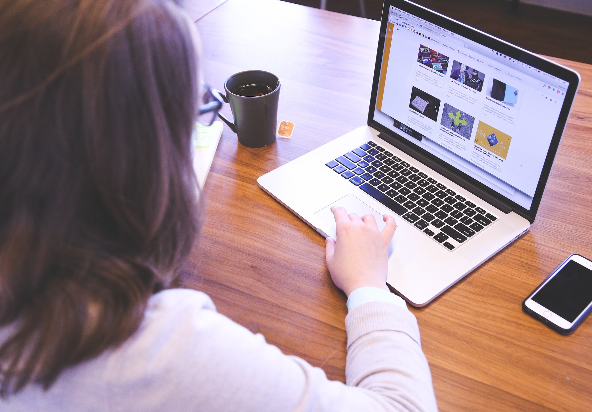 Girl typing on a laptop