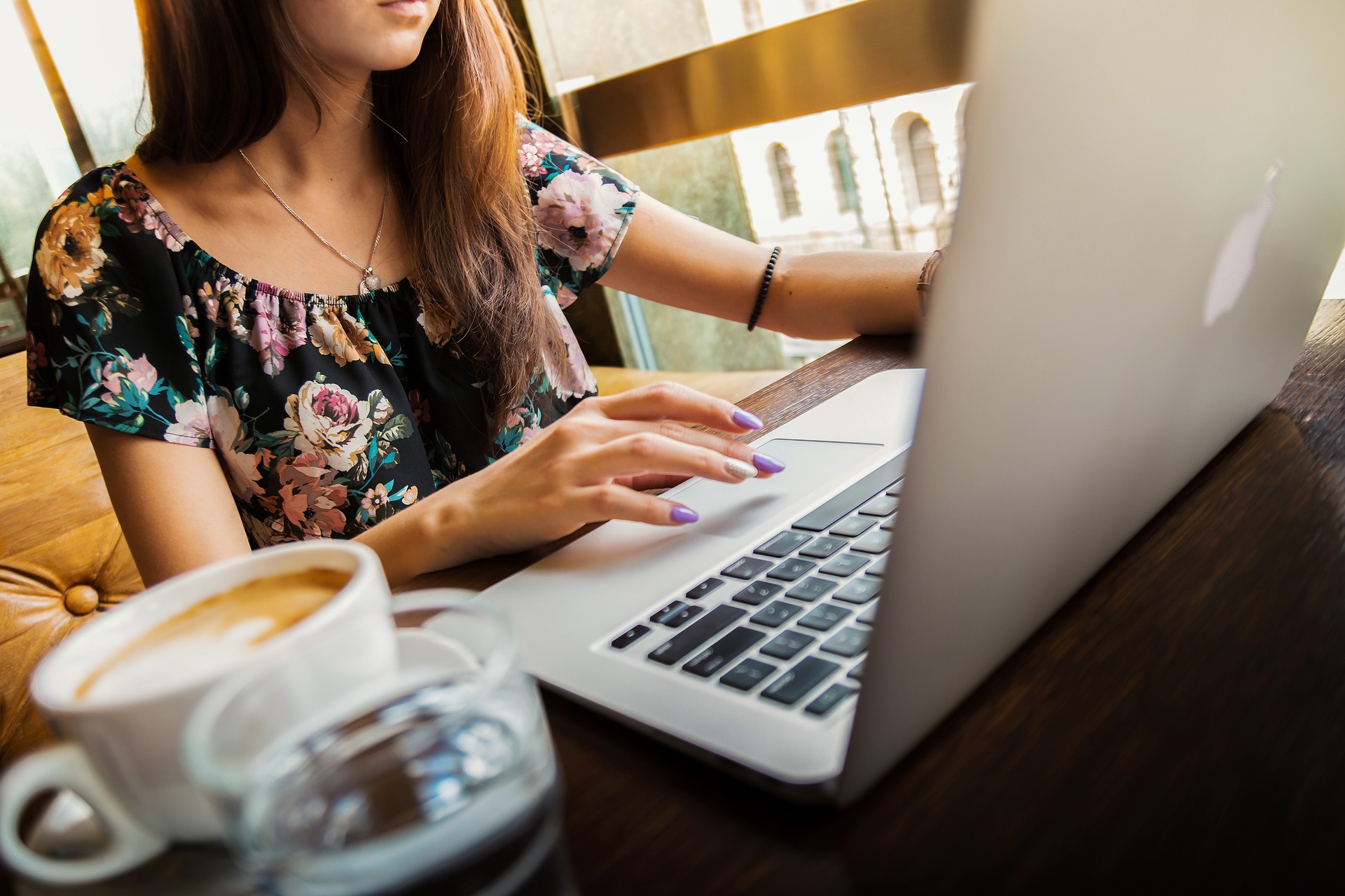 Woman typing on laptop