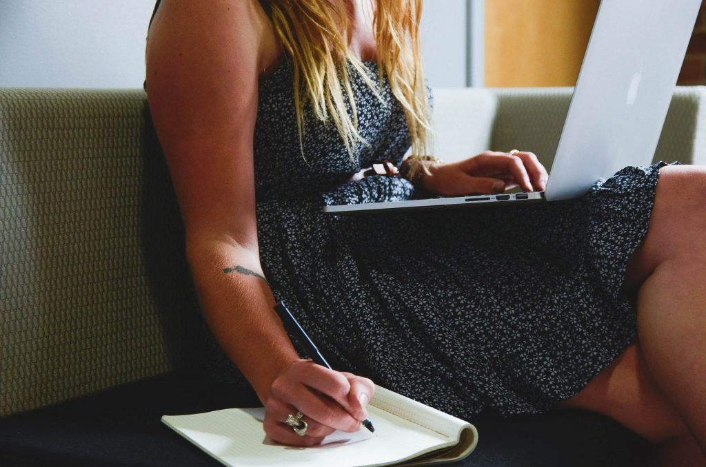 Woman writing in notebook