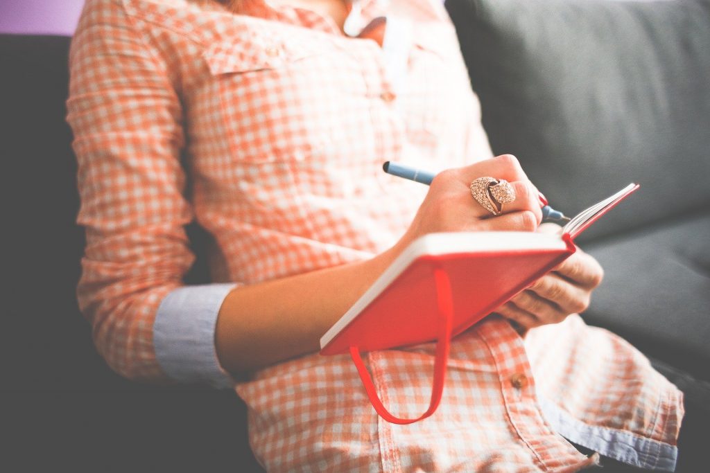 Female writing in a notebook