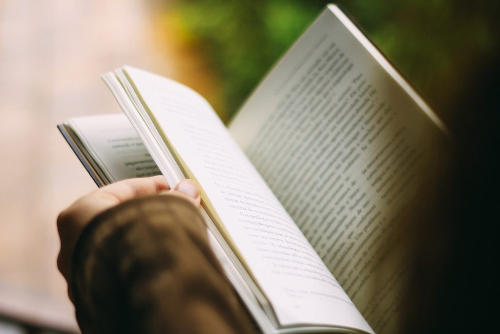 Woman flipping the pages of a book