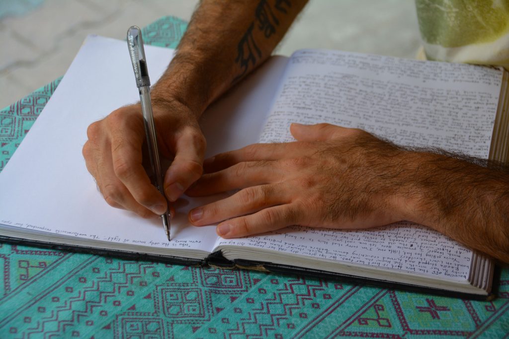 Person writing by hand