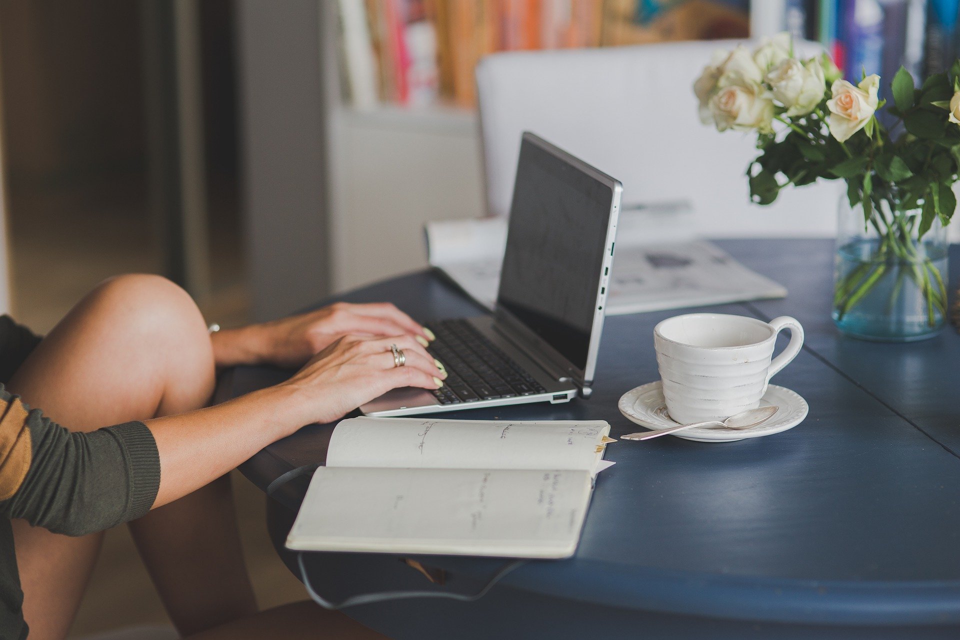 Woman typing on a laptop