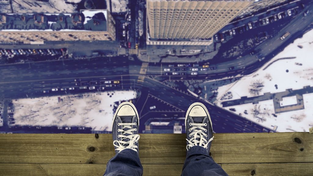 Person standing on a ledge