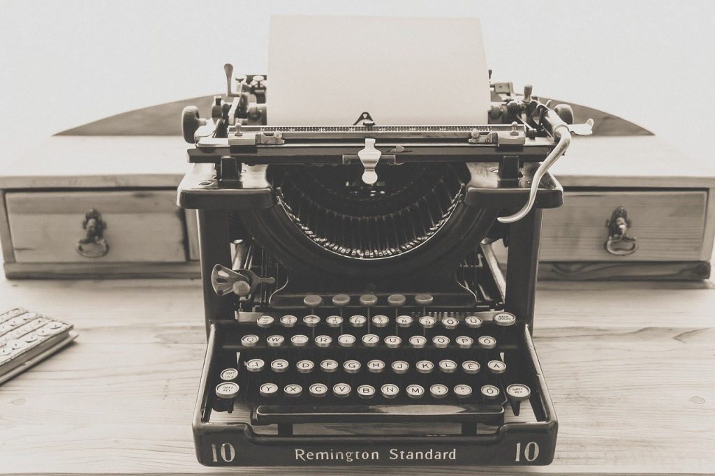 Typewriter with blank paper